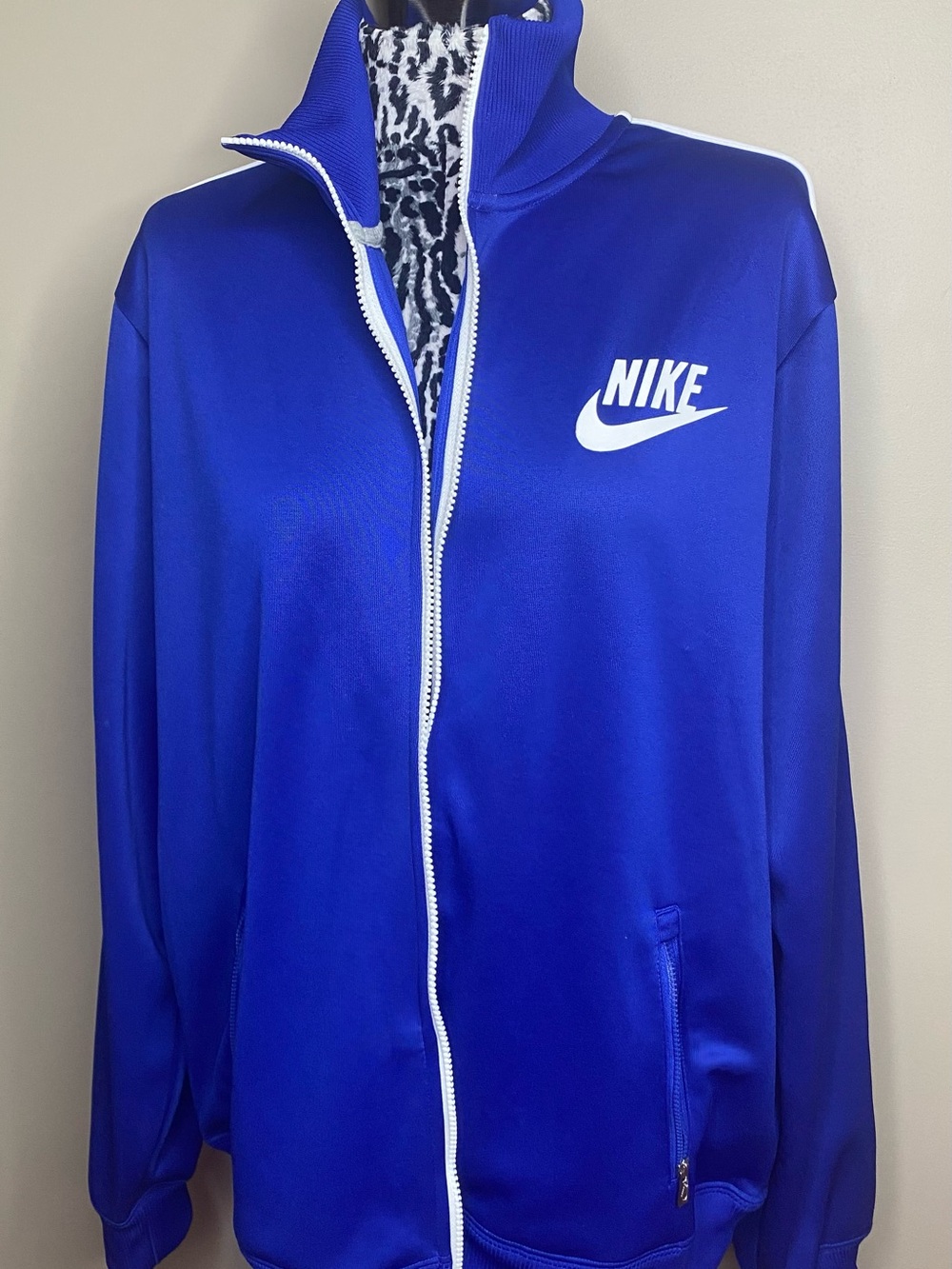 Nike Blue Athletic Top with White Trim and Logo Tag